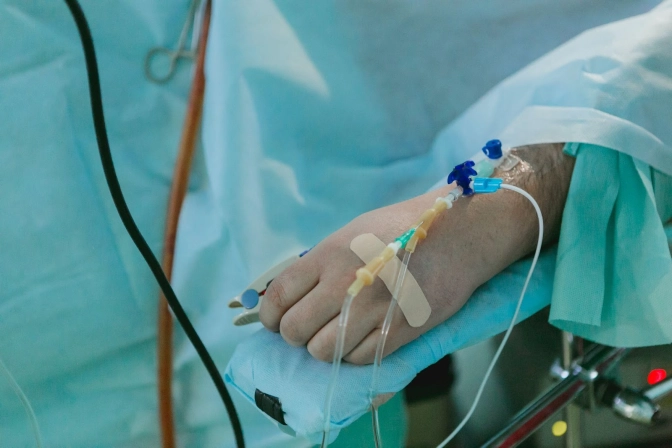 &nbsp;A hospital patient with an IV drip on the hand