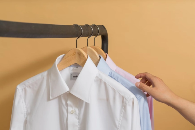 White buttoned up shirt on clothes hanger