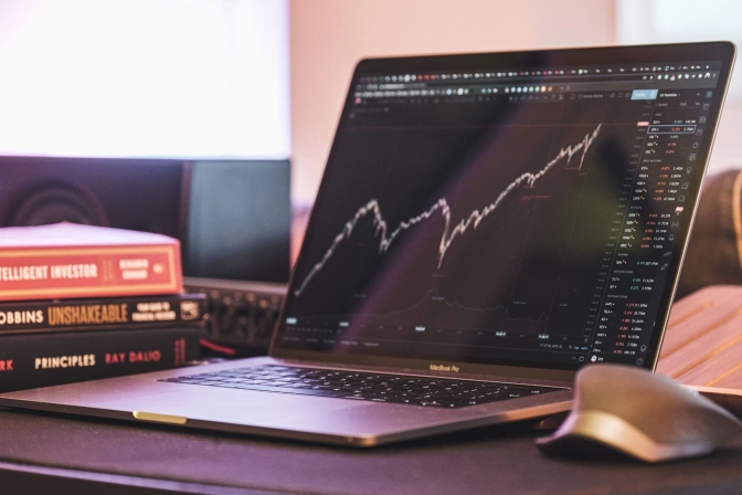 A laptop with an investment stocks chart interface&nbsp;